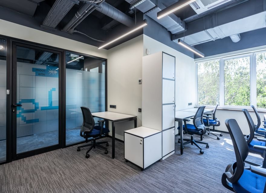 Modern office with wooden tables and chairs