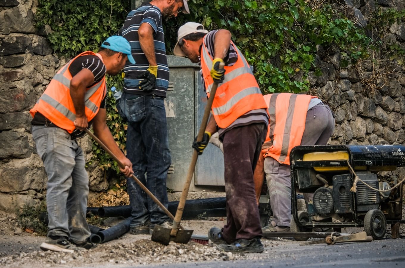 Two workers on a construction site during daytime