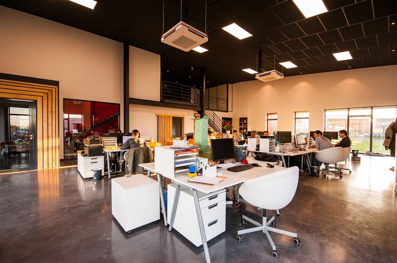 Modern office interior with desks and chairs being set up