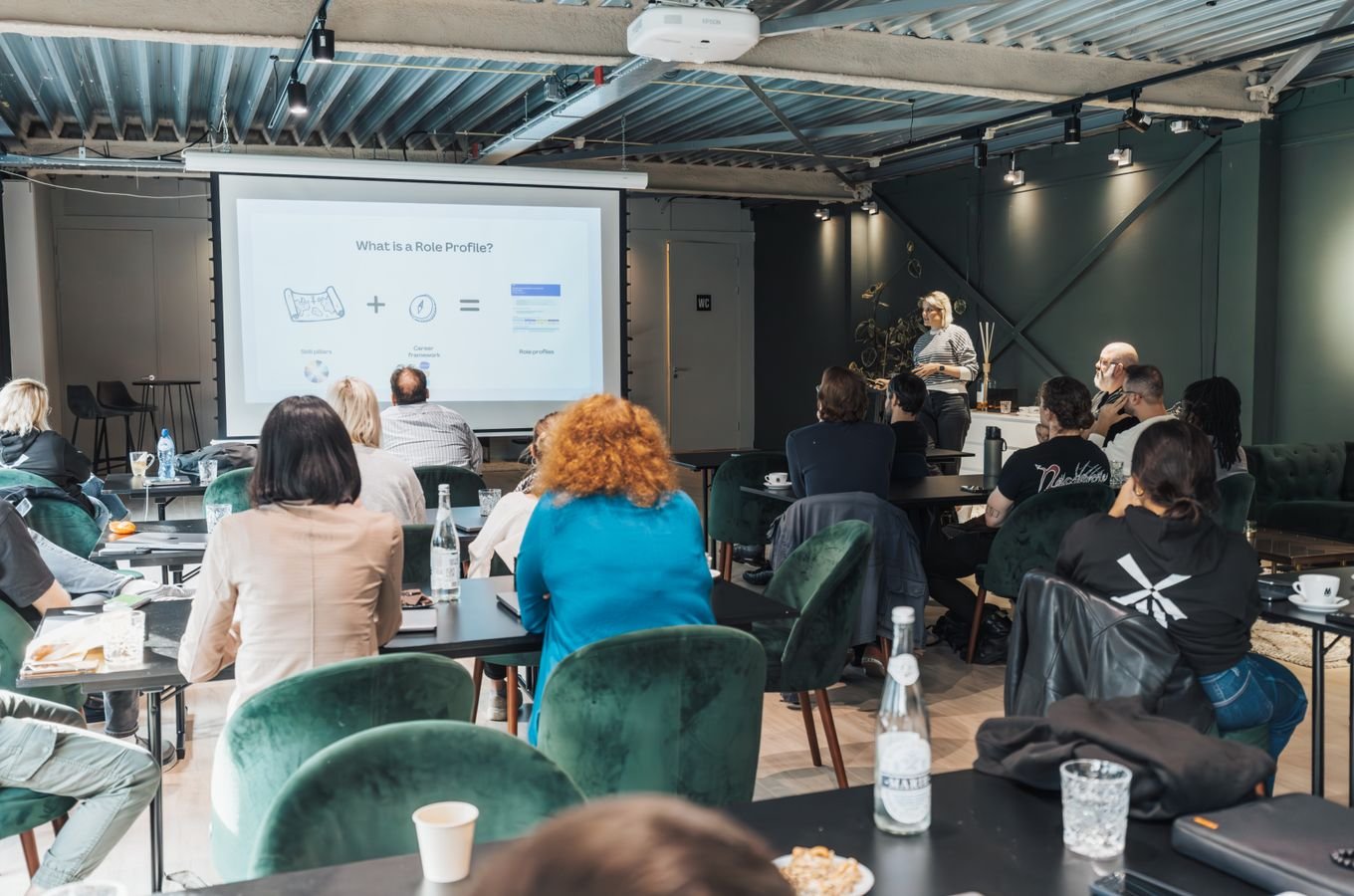 Professionals attending a training session in a modern office