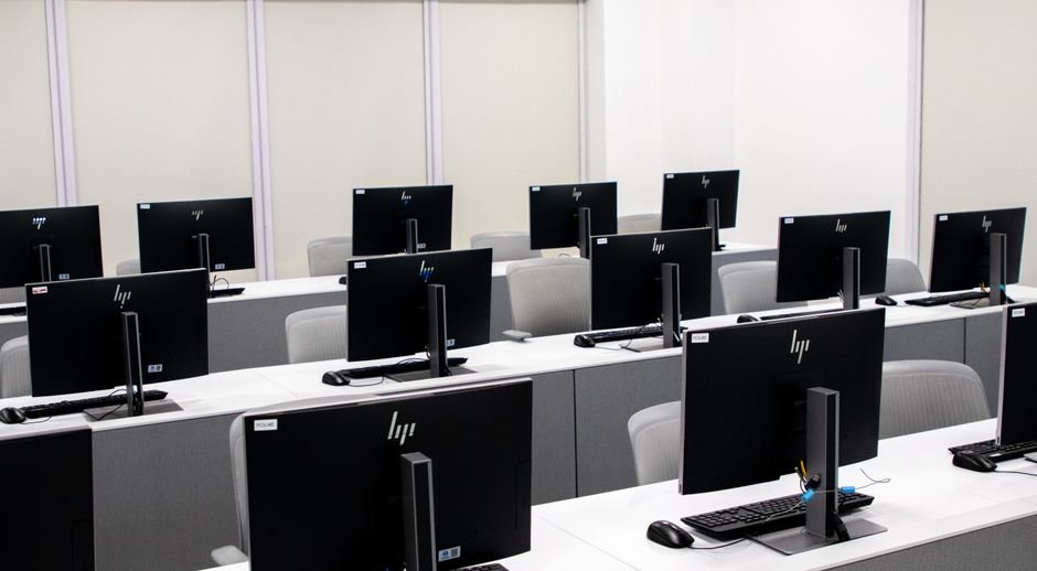 Classroom with rows of computers and monitors